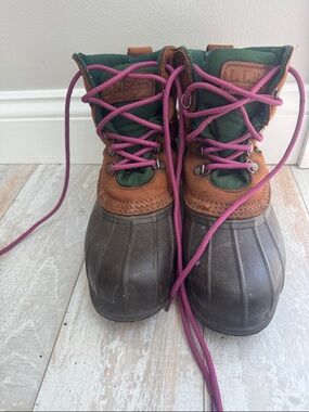 L.L. Bean Cushion Top Bean Boots 
Brown leather with green canvas accents